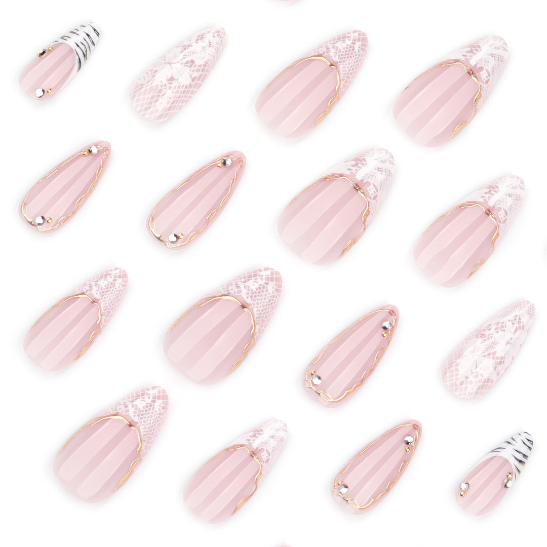 Artful stiletto nails with gold and tip embellishments Bowlift