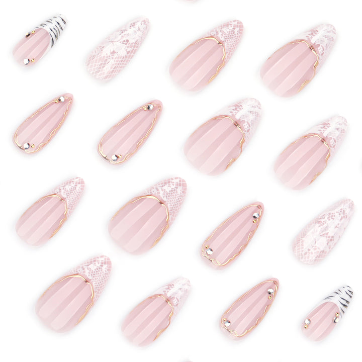 Artful stiletto nails with gold and tip embellishments Bowlift