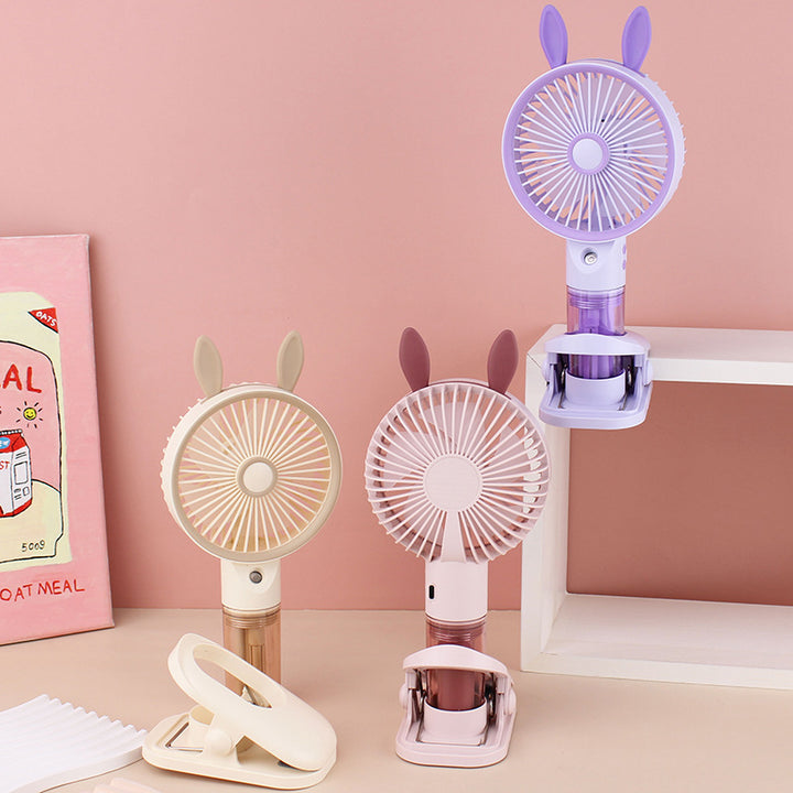 Cooling compact rechargeable clip-on misting handheld fan with detachable water reservoir and adjustable tilt Bowlift