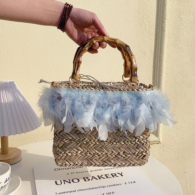 Elegant handbag with feathers and bamboo handles Bowlift