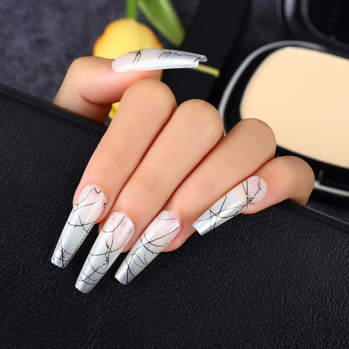 Artificial nails in modern ombre design with marbled accents Bowlift