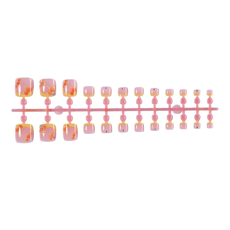Artificial nail set with floral design and glitter accents Bowlift