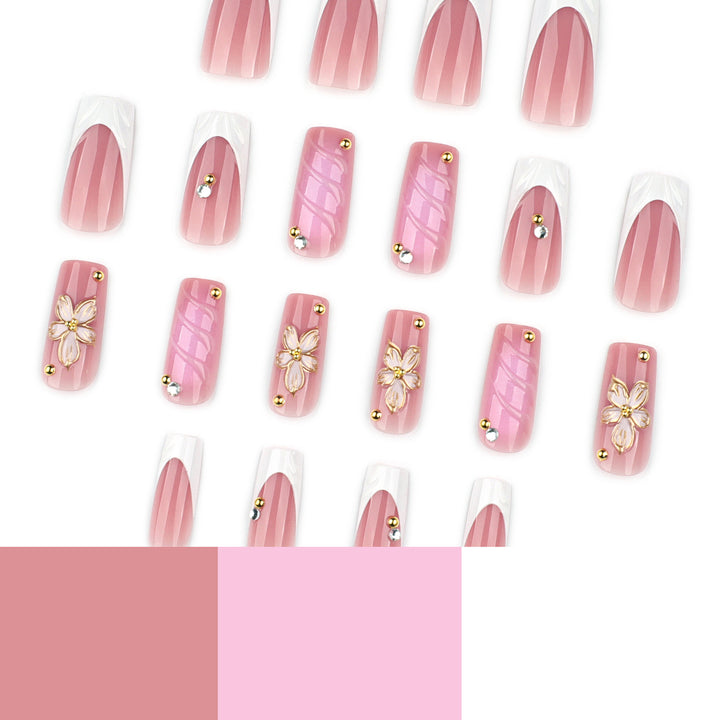 Glamorous gel nails with floral accent and glitter details Bowlift