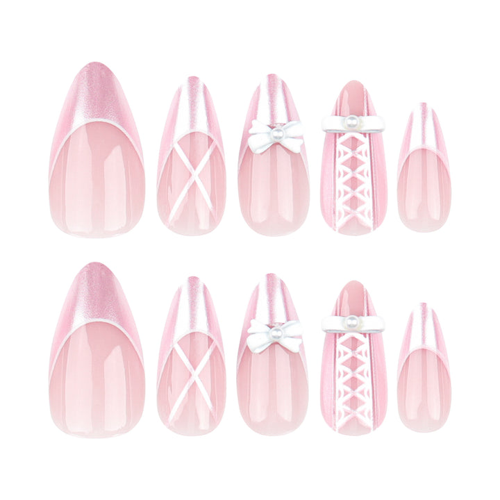 Artistic stiletto nails with elegant pearl and bow accents Bowlift