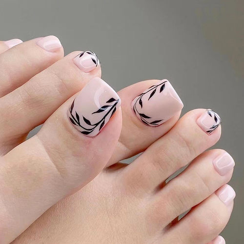 Artful toenail art with delicate leaf motifs Bowlift