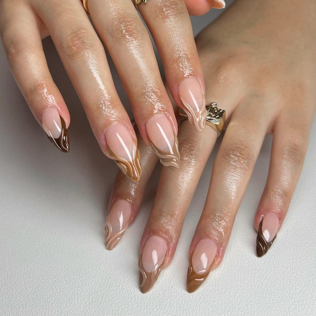 Artful stiletto nails with elegant gradient and glitter accents Bowlift