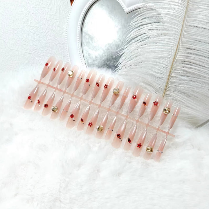 Glamorous artificial nails with shimmering embellishments Bowlift
