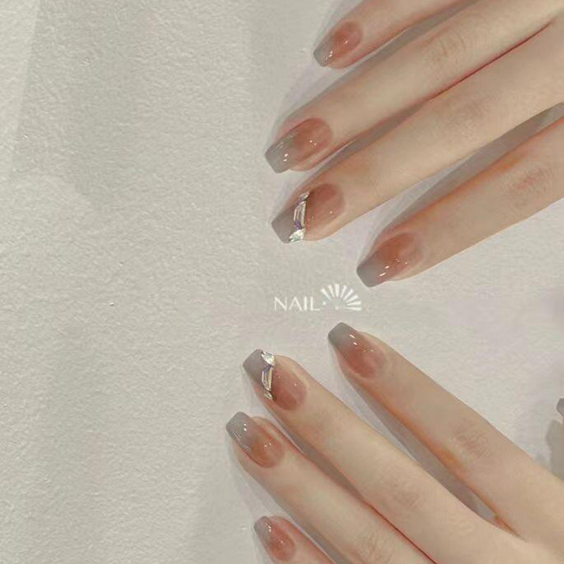 Artificial nail set with elegant ombre design and sparkling applications Bowlift