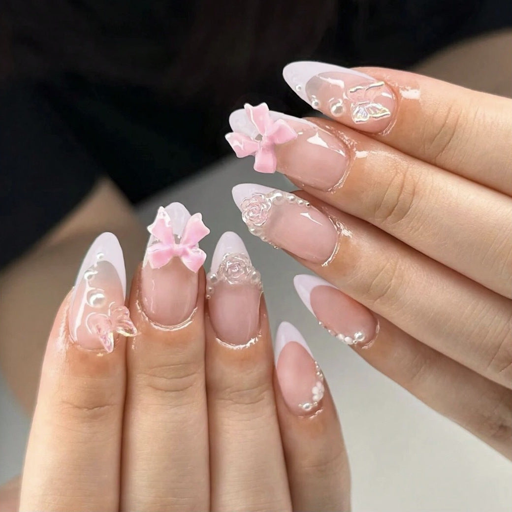 Artificial nail set with romantic flower and glitter accents Bowlift
