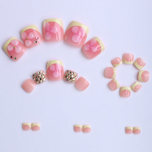 Artificial nail extensions with flower design and glitter accents Bowlift