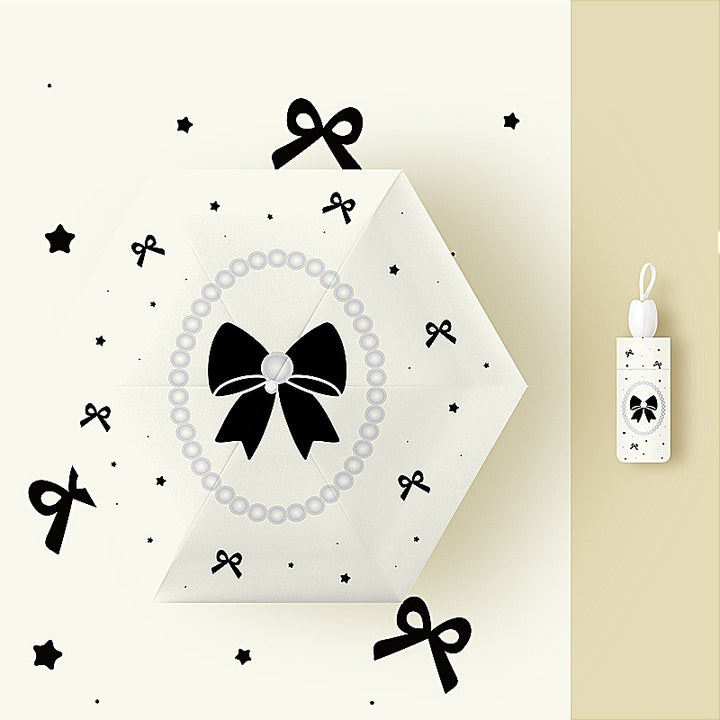 Ladies folding umbrella with playful flower design Bowlift