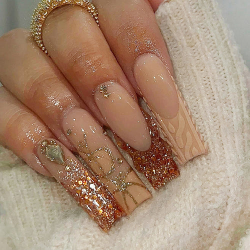 Glamorous artificial nail set with glitter and elegant embellishments Bowlift