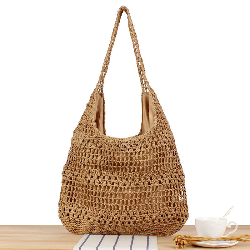 Handbag with floral appliqué Made of natural material Bowlift