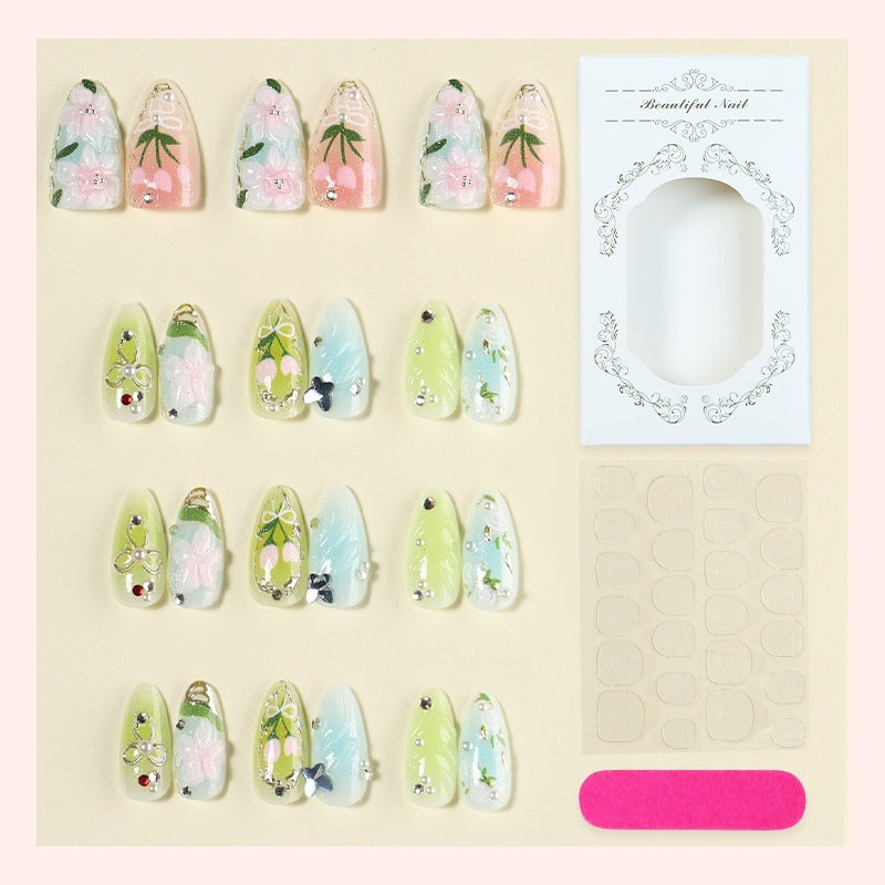 Creative nail set with hand-drawn floral patterns and glitter accents Bowlift