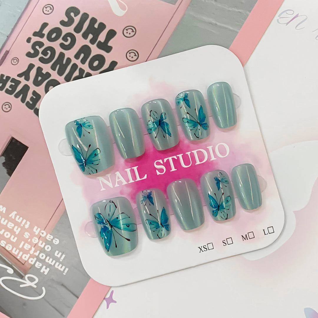 Artistic acrylic nails with butterfly motif Bowlift