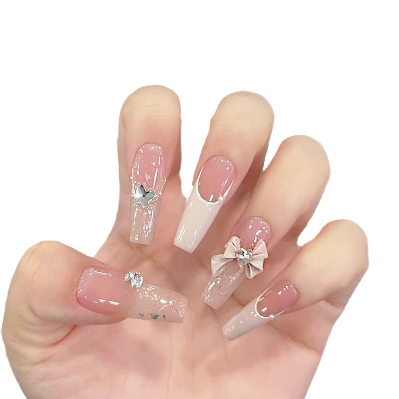 Artificial nails with glitter accents and playful motifs Bowlift