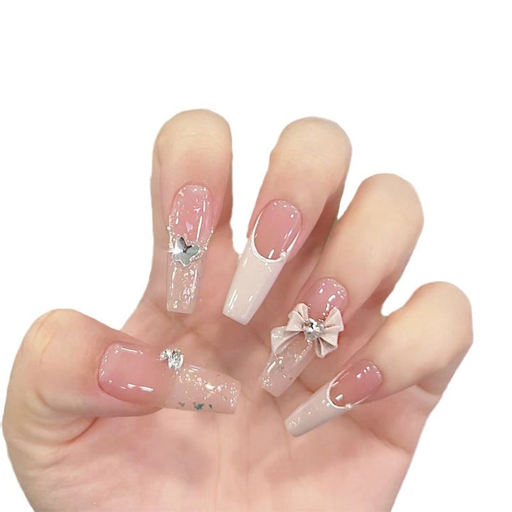 Artificial nails with glitter accents and playful motifs Bowlift