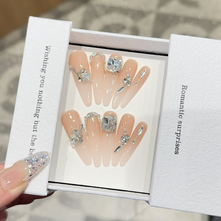 Artificial nails with exclusive rhinestone embellishments Bowlift