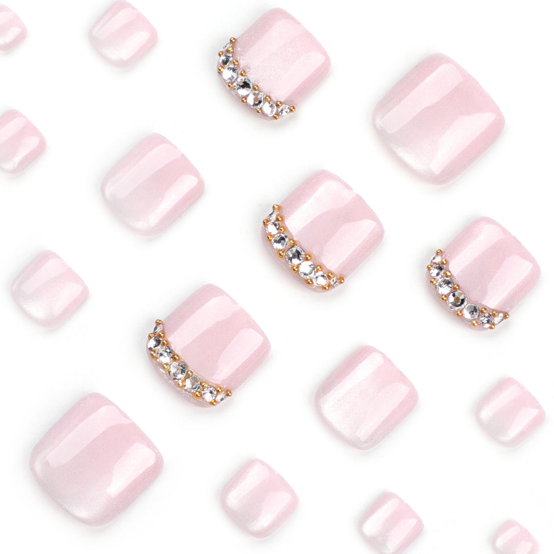 Artful toenail art with glitter and rhinestone decorations Bowlift