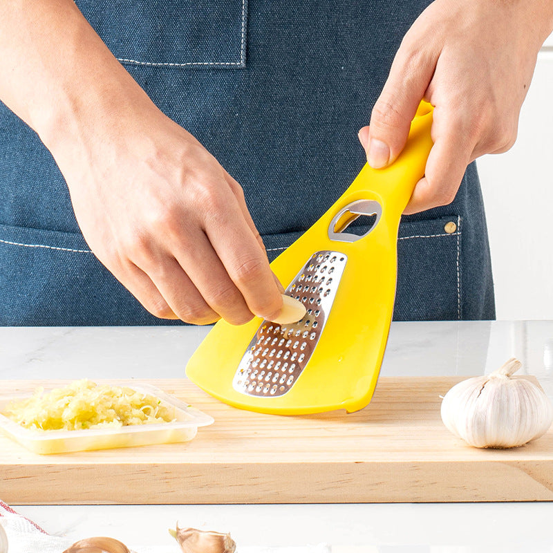 Multifunctional kitchen grater with integrated bottle opener function Bowlift