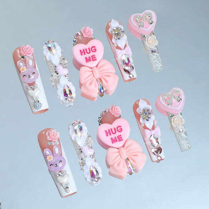 Creative nail art set with playful animal and heart motifs Bowlift