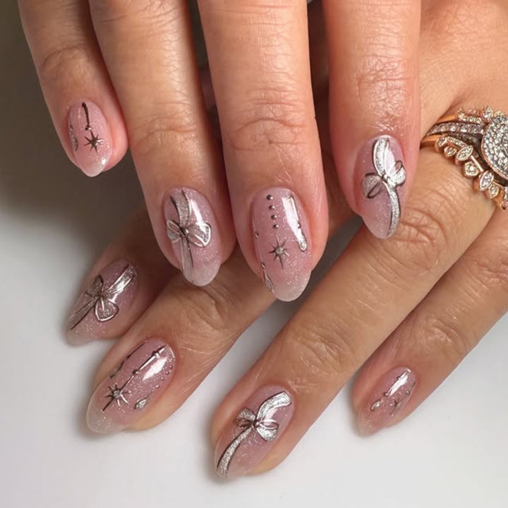 Artificial nail art with playful dots and bows Bowlift
