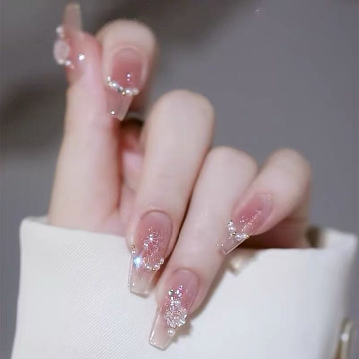 Artificial nails with glitter accents and playful motifs Bowlift