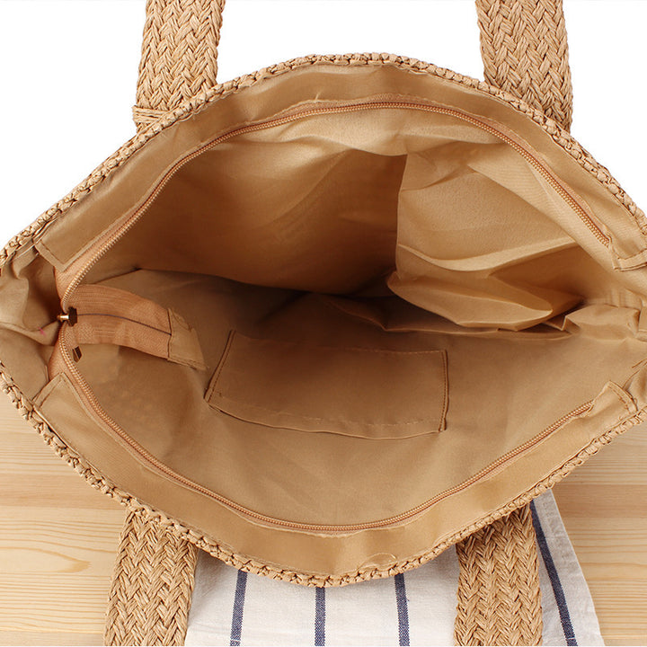 Eco-friendly straw tote bag with elegant tassel detail Bowlift
