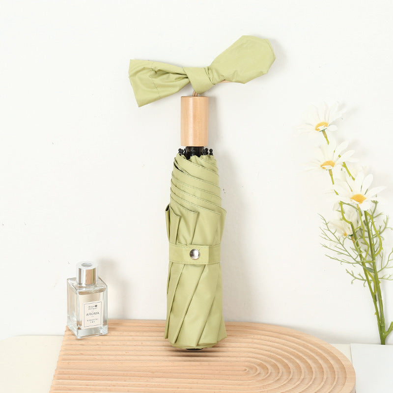 Ladies compact folding umbrella with elegant design and ergonomic wooden handle Bowlift