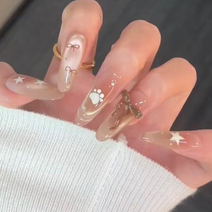 Artificial nail set with festive gift design and elegant glitter accents Bowlift
