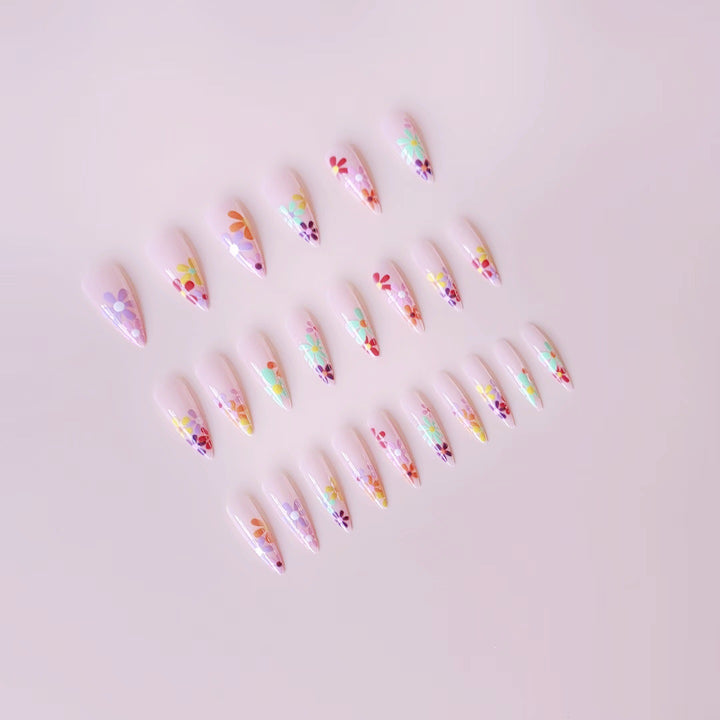 Acrylic nail set with vibrant floral designs and sharp accents Bowlift