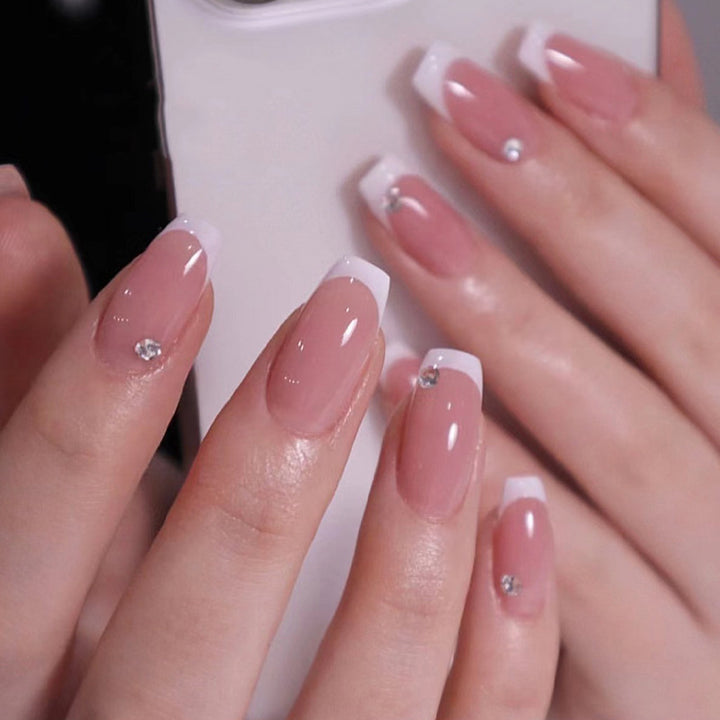 Glamorous artificial nails with French manicure Bowlift