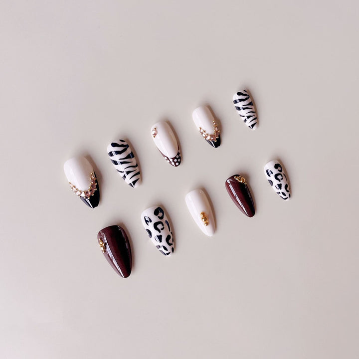 Acrylic nail set with luxurious animal motif designs and glamorous accents Bowlift
