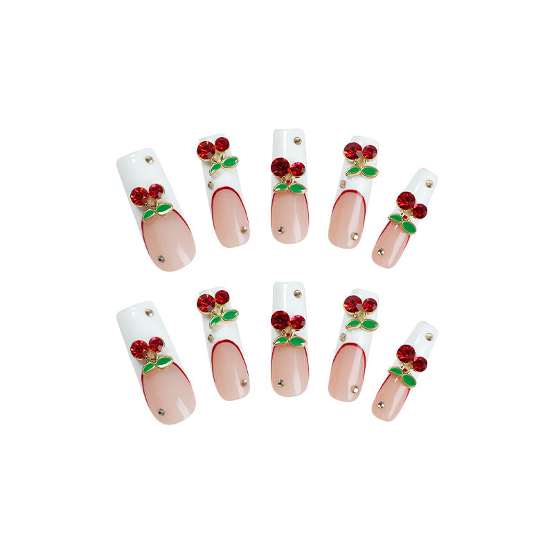 Artificial nail set with cherry motif and sparkling rhinestones Bowlift