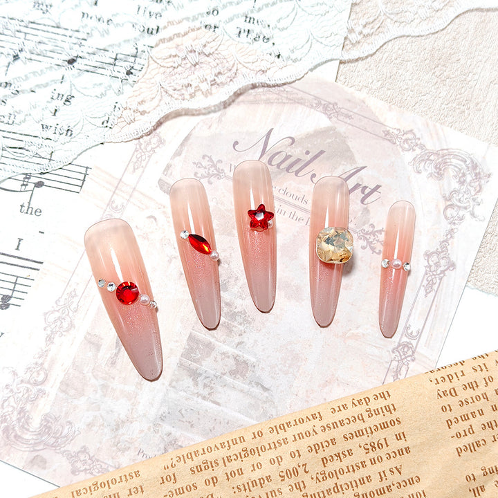 Artificial nails with glamorous decorations Bowlift