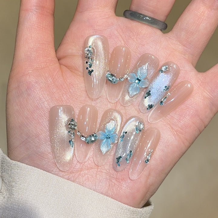 Artificial nails with unique floral design and glitter accents Bowlift