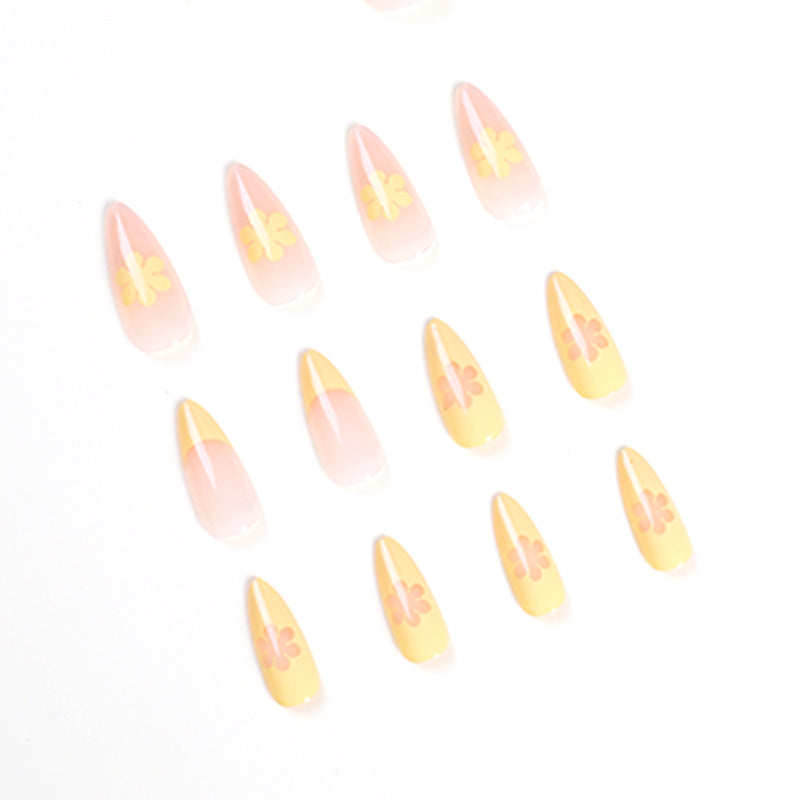 Artful nail designs with floral accents and gradient Bowlift