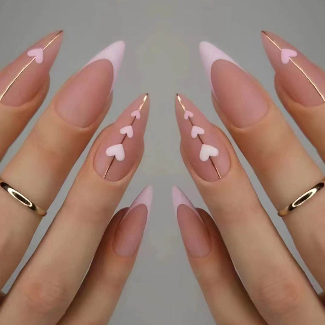 Artful stiletto nails with heart accents Bowlift