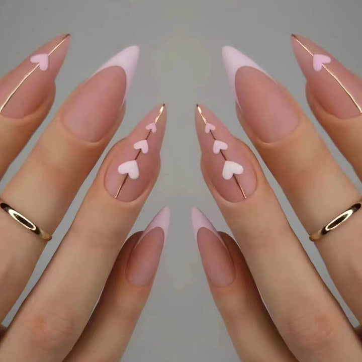 Artful stiletto nails with heart-shaped accents Bowlift