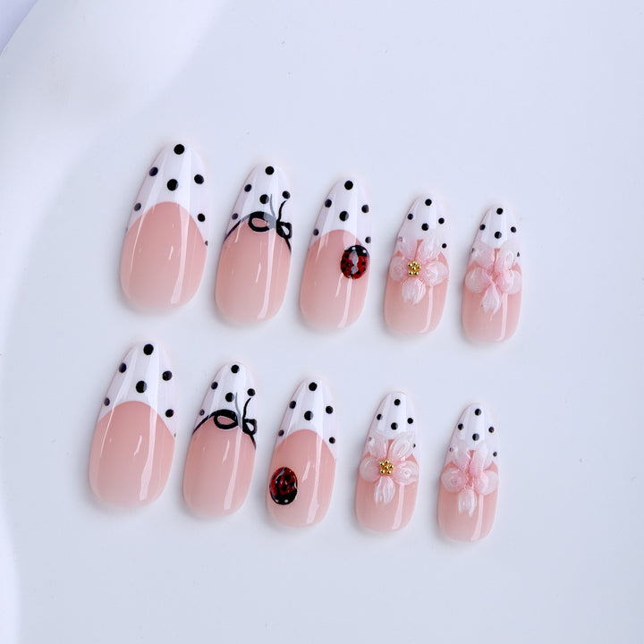 Artificial nail art with floral and playful accents Bowlift