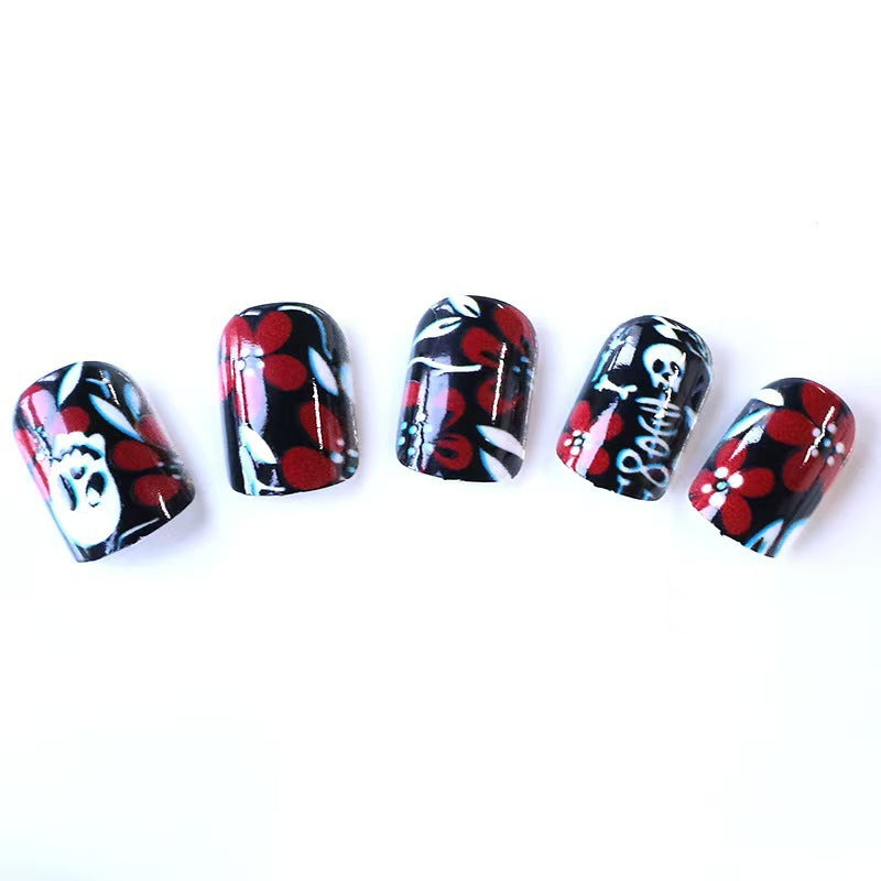 Artificial nail set with creepy skull design and floral accents Bowlift