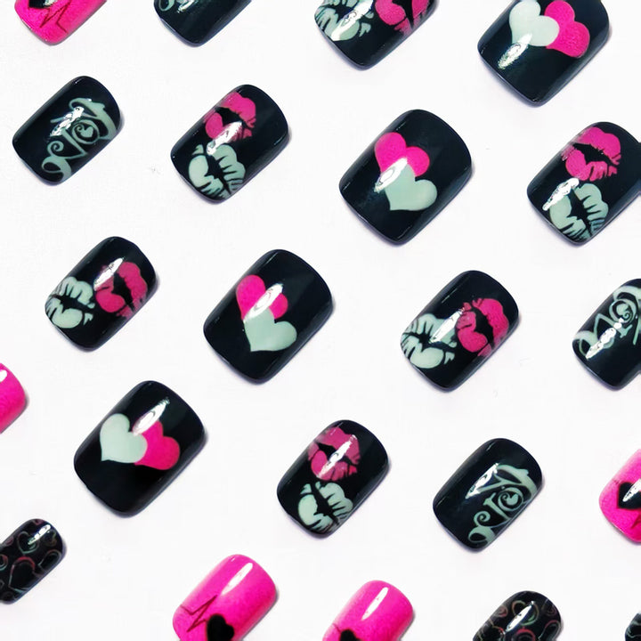 Acrylic nail design with hearts and kiss motifs Bowlift