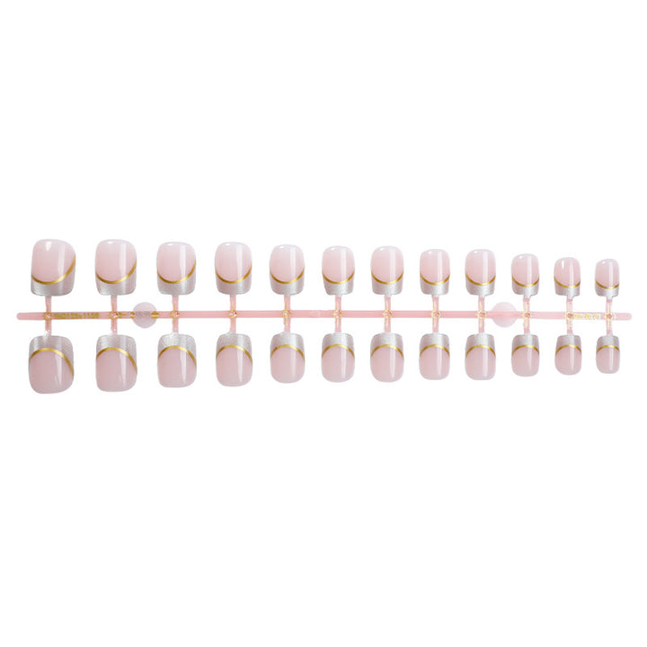 Artificial nail creations with elegant gold trim Bowlift