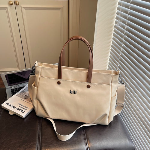 Shopping bag with comfortable carrying system and practical outer pockets Bowlift
