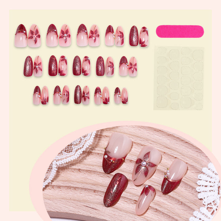 Glamorous artificial nail set with elegant floral and glitter details Bowlift