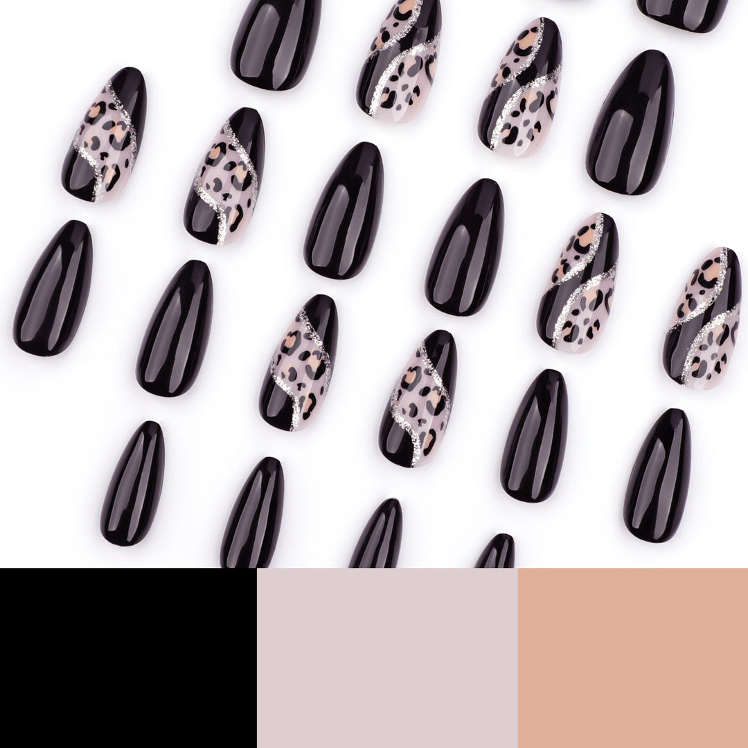 Artistic stiletto nails with leopard design and glitter effects Bowlift