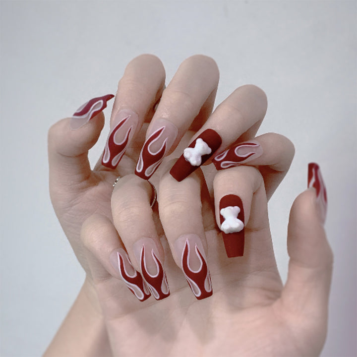 Artful stiletto nails with fiery flame design Bowlift