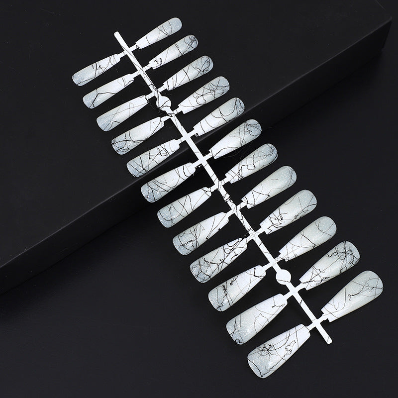 Artificial nails in modern ombre design with marbled accents Bowlift