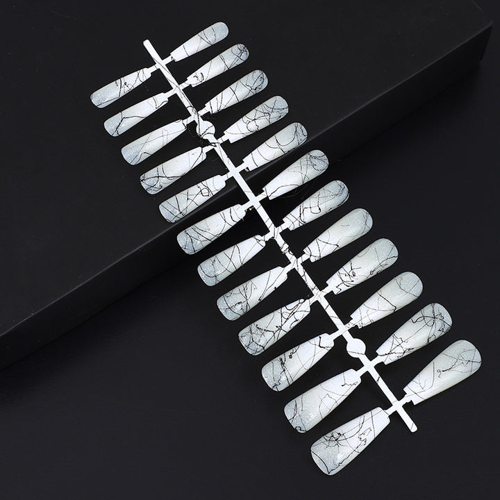 Artificial nails in modern ombre design with marbled accents Bowlift