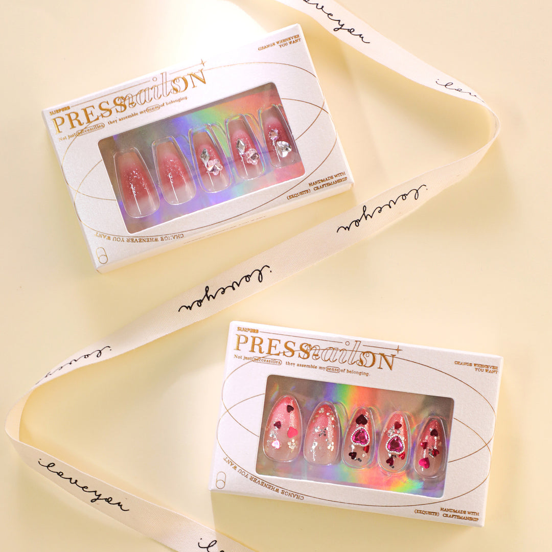 Artful nail art with playful heart designs and glitter Bowlift